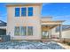 Home's back elevation with covered patio and fenced backyard at 6848 Good News Dr, Charlotte, NC 28215