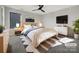 Virtually staged bedroom with light wood furniture and a neutral color scheme at 6848 Good News Dr, Charlotte, NC 28215
