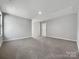 Spacious bonus room with carpeted floor and access to other rooms at 6848 Good News Dr, Charlotte, NC 28215