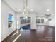 Sunlit dining room with hardwood floors and sliding glass doors at 6848 Good News Dr, Charlotte, NC 28215