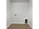 Laundry room with tile flooring and built-in shelving at 6848 Good News Dr, Charlotte, NC 28215