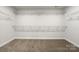 Bright walk-in closet with wire shelving at 6848 Good News Dr, Charlotte, NC 28215