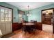 Dining room with wood floor and wood-paneled walls at 7100 Leesburg Rd, Charlotte, NC 28215