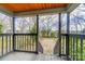 Wooden deck overlooking backyard with mature trees at 804 Rayon St, Charlotte, NC 28216