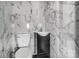 Small bathroom with dark vanity and marble tile at 804 Rayon St, Charlotte, NC 28216