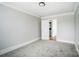 Bright bedroom with neutral walls and carpet at 804 Rayon St, Charlotte, NC 28216
