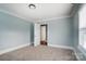 Bright bedroom with open door to hallway at 804 Rayon St, Charlotte, NC 28216