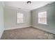 Simple bedroom with neutral walls and carpet at 804 Rayon St, Charlotte, NC 28216