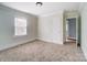 Neutral-toned bedroom with carpet flooring and closet at 804 Rayon St, Charlotte, NC 28216