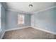 Charming bedroom with light blue walls and carpet at 804 Rayon St, Charlotte, NC 28216