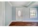 Front entry with wood floors and light blue walls at 804 Rayon St, Charlotte, NC 28216