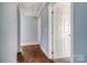 Light gray walls and wood flooring in the hallway at 804 Rayon St, Charlotte, NC 28216