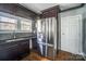 Stainless steel refrigerator and dark wood cabinets in kitchen at 804 Rayon St, Charlotte, NC 28216