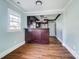 Modern kitchen with dark wood cabinets and granite countertops at 804 Rayon St, Charlotte, NC 28216