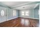 Spacious living area with wood floors and light blue walls at 804 Rayon St, Charlotte, NC 28216