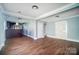 Open living area with hardwood floors and built-in bar at 804 Rayon St, Charlotte, NC 28216