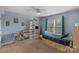 Light and bright bedroom with a twin-size bed and built-in shelving at 8514 Ulster Ct, Indian Land, SC 29707