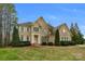 Two-story brick home with manicured lawn and landscaping at 8514 Ulster Ct, Indian Land, SC 29707