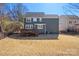 Exterior shot of a two-story home with a deck, grass, and a fence surrounding the yard at 857 Spelman Dr, Indian Land, SC 29707