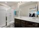 This bathroom features double vanity sinks, a shower, and a toilet at 857 Spelman Dr, Indian Land, SC 29707