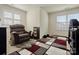 Bedroom with light walls, carpet, and a comfortable recliner by two windows at 857 Spelman Dr, Indian Land, SC 29707