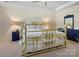 Comfortable bedroom with brass bed frame, neutral walls, and an abundance of natural light at 857 Spelman Dr, Indian Land, SC 29707
