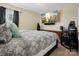 Bedroom with large bed, TV, speakers, and dark curtains at 857 Spelman Dr, Indian Land, SC 29707