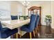 A dining room with hardwood floors, neutral walls, shuttered windows, and a large china cabinet at 857 Spelman Dr, Indian Land, SC 29707