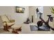 Carpeted exercise room with TV, rocking chair, weights, and a Peloton bike at 857 Spelman Dr, Indian Land, SC 29707