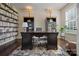 Home office with built-in shelves, a large desk, and hardwood floors at 857 Spelman Dr, Indian Land, SC 29707
