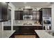 Kitchen with dark cabinetry, granite countertops, and stainless steel appliances at 857 Spelman Dr, Indian Land, SC 29707