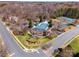 Aerial view of community amenities, including a pool, playground, parking, and tennis courts at 10111 Grimsby Ct, Huntersville, NC 28078