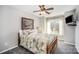 Bedroom featuring carpeted floor, ceiling fan, and large window at 10111 Grimsby Ct, Huntersville, NC 28078