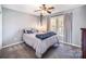 Bedroom featuring gray walls, carpeted floor, and rope light fixture at 10111 Grimsby Ct, Huntersville, NC 28078