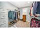 Walk-in closet with ample storage and organization racks at 10111 Grimsby Ct, Huntersville, NC 28078