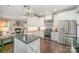 Modern kitchen with stainless steel appliances and open concept design at 10111 Grimsby Ct, Huntersville, NC 28078