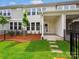 A well-maintained backyard with green grass and a small tree at 10117 Mamillion Dr, Huntersville, NC 28078