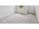 A bright bedroom with neutral walls and carpet at 10117 Mamillion Dr, Huntersville, NC 28078