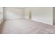 Spacious bedroom with neutral carpeting and multiple windows to maximize natural light at 10117 Mamillion Dr, Huntersville, NC 28078