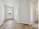 Bright entryway featuring durable wood-look flooring and access to other rooms at 10117 Mamillion Dr, Huntersville, NC 28078