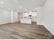 Bright, open-concept kitchen with a white island and modern stainless steel appliances at 10117 Mamillion Dr, Huntersville, NC 28078