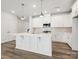 Bright kitchen featuring a large island, pendant lighting, and ample cabinet space at 10117 Mamillion Dr, Huntersville, NC 28078