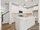 Modern kitchen boasts white cabinetry, a large island, and stainless steel appliances at 10117 Mamillion Dr, Huntersville, NC 28078
