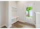 Mud room features a door to the backyard and a convenient bench and storage area at 10117 Mamillion Dr, Huntersville, NC 28078