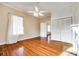 Bedroom with hardwood floors, ceiling fan, and built-in closet at 124 Piedmont St, Rock Hill, SC 29730