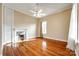 Hardwood floor bedroom with fireplace and ceiling fan at 124 Piedmont St, Rock Hill, SC 29730