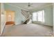 Living room featuring stairs, a ceiling fan, and soft carpeting at 124 Piedmont St, Rock Hill, SC 29730