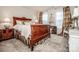 Bedroom with antique wood bed and neutral decor at 127 Doncaster Dr, Mooresville, NC 28115