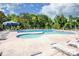 Community pool with multiple lounging areas and shade umbrellas at 127 Doncaster Dr, Mooresville, NC 28115