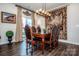 Charming dining area with a wooden table and tapestry at 127 Doncaster Dr, Mooresville, NC 28115